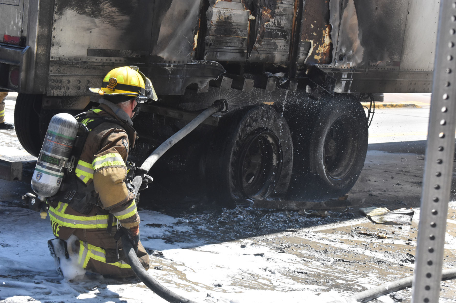 Hosing off semi after fire
